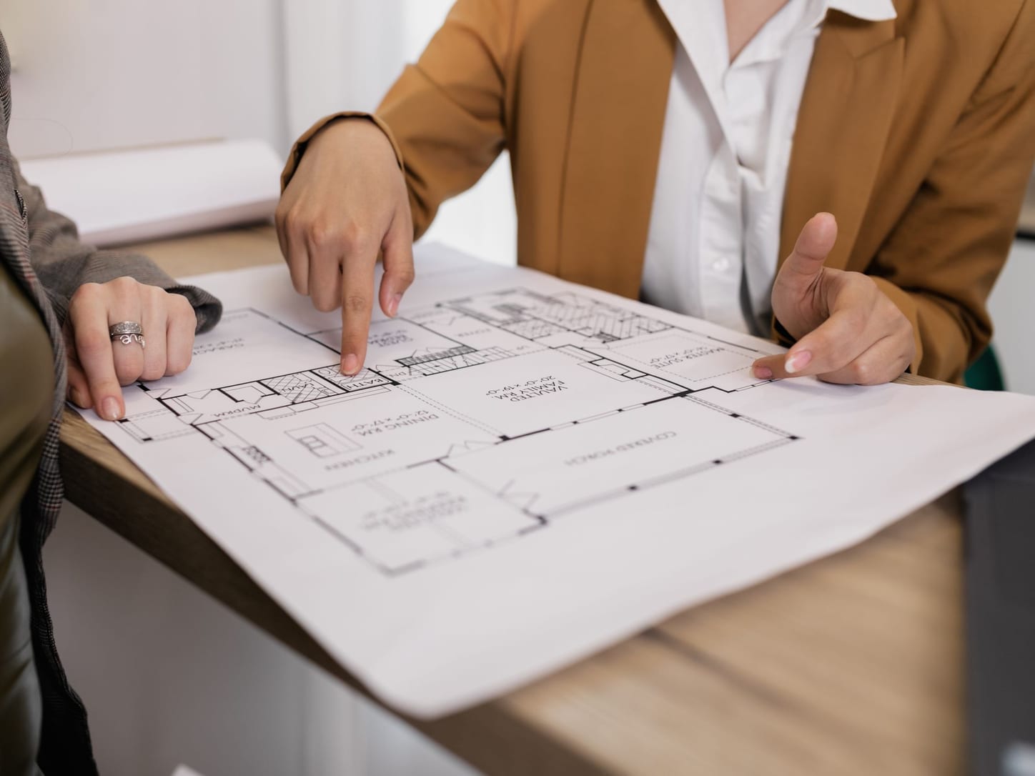 Engineers reviewing a project drawing together